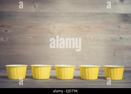 Paper muffin cups isolated on white background Stock Photo