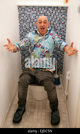 Man On Toilet Stock Photo