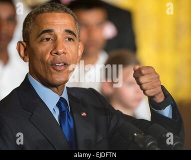 US President Barack Obama delivers remarks in the East Room of the White House during the fifth White House Science Fair March 23, 2015 in Washington, DC. The Fair showcased the science, technology, engineering, and math achievements of over 100 students from across the country. Stock Photo