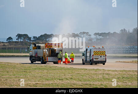 Runway maintenance being carried out on the 05-23 flight landing area RAF Lossiemouth air field base.  SCO 9659. Stock Photo
