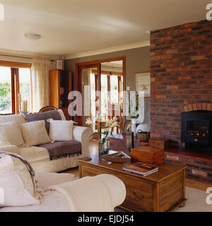 COSY decorating letters against a rustic brick wall above a wood burning  stove Stock Photo - Alamy