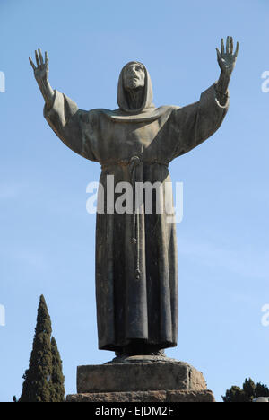 Statue of St Francis of Assisi, part of a bronze sculptural group by Giuseppe Tonnini, 1927. Stock Photo