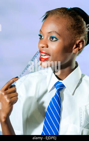 Kenyan school girl in studio setting Stock Photo