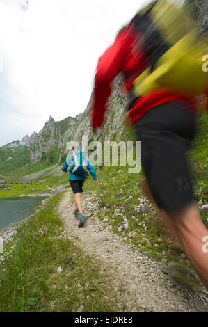 Man and woman hiking, Appenzellerland, Switzerland. Stock Photo