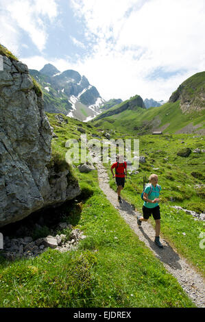 Man and woman hiking, Appenzellerland, Switzerland. Stock Photo