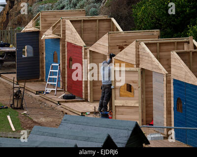 New beach huts being built ready for summer, Bude, Cornwall, UK Stock Photo