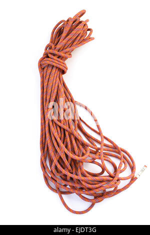 Short 60 metre coiled red safety climbing rope cut-out and isolated on a plain white background close up. Stock Photo