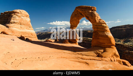 View of Delicate Arch with the La Sal mountain range in the background, Arches National Park, Utah. Stock Photo