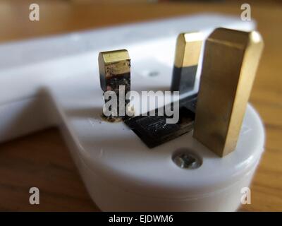Burnt Plug Adapter Burnt electrical plug Stock Photo - Alamy