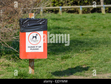 Dog waste bin in a park in the UK. Stock Photo