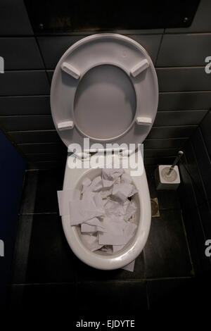 toilet clogged with toilet paper Stock Photo - Alamy
