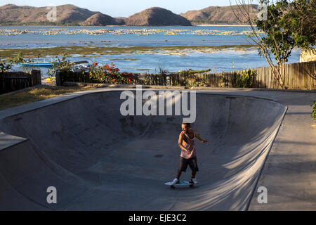 Surf skating in pool near the ocean. Stock Photo