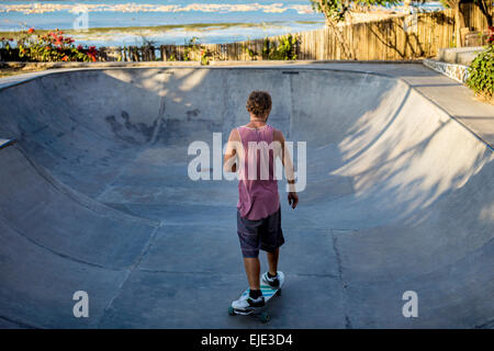 Surf skating in pool near the ocean. Stock Photo