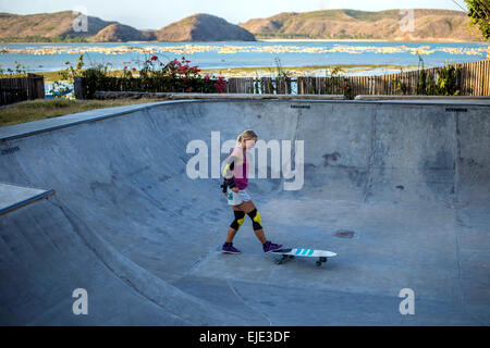 Surf skating in pool near the ocean. Stock Photo