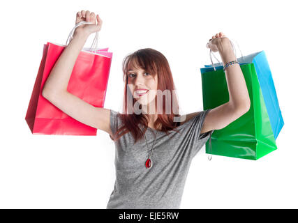 Young Woman Holding Colorful Shopping Bags Stock Photo