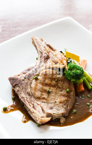Gourmet Main Entree Course grilled pork chop Stock Photo