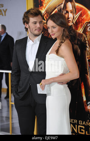 LOS ANGELES, CA - NOVEMBER 17, 2014: Sam Claflin & wife Laura Haddock at the Los Angeles premiere of his movie 'The Hunger Games: Mockingjay Part One' at the Nokia Theatre LA Live. Stock Photo