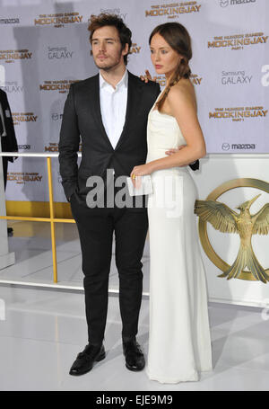 LOS ANGELES, CA - NOVEMBER 17, 2014: Sam Claflin & wife Laura Haddock at the Los Angeles premiere of his movie 'The Hunger Games: Mockingjay Part One' at the Nokia Theatre LA Live. Stock Photo