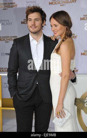 LOS ANGELES, CA - NOVEMBER 17, 2014: Sam Claflin & wife Laura Haddock at the Los Angeles premiere of his movie 'The Hunger Games: Mockingjay Part One' at the Nokia Theatre LA Live. Stock Photo