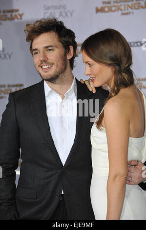 LOS ANGELES, CA - NOVEMBER 17, 2014: Sam Claflin & wife Laura Haddock at the Los Angeles premiere of his movie 'The Hunger Games: Mockingjay Part One' at the Nokia Theatre LA Live. Stock Photo