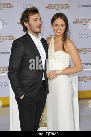 LOS ANGELES, CA - NOVEMBER 17, 2014: Sam Claflin & wife Laura Haddock at the Los Angeles premiere of his movie 'The Hunger Games: Mockingjay Part One' at the Nokia Theatre LA Live. Stock Photo