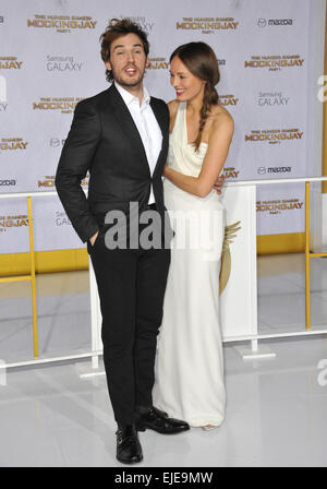 LOS ANGELES, CA - NOVEMBER 17, 2014: Sam Claflin & wife Laura Haddock at the Los Angeles premiere of his movie 'The Hunger Games: Mockingjay Part One' at the Nokia Theatre LA Live. Stock Photo