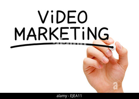 Hand writing Video Marketing with black marker on transparent wipe board. Stock Photo