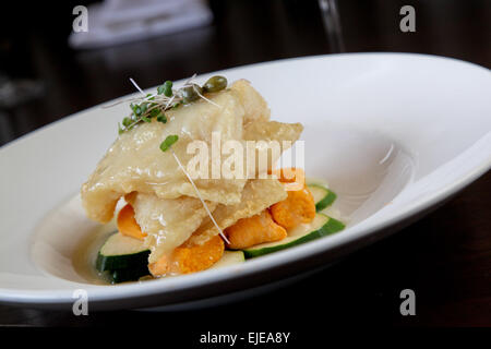 haddock over sweet potatoes and zucchini Stock Photo