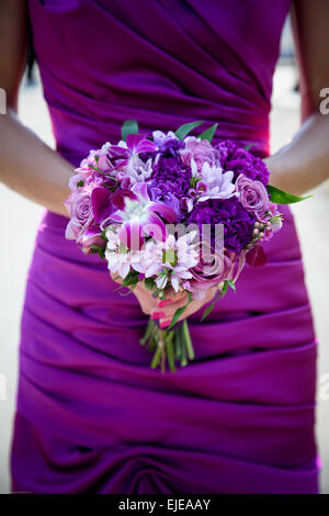 wedding bouquet of flowers for bridesmaid with a purple theme Stock Photo