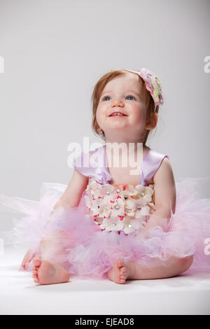 very happy one year old girl in tutu Stock Photo