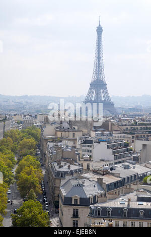 In a view from atop the Arc du Triomphe, the famous Eiffel Tower rises above Paris, France on a lovely fall afternoon. Stock Photo