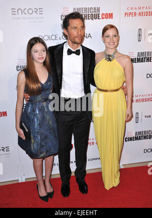 LOS ANGELES, CA - OCTOBER 21, 2014: Matthew McConaughey with Jessica Chastain (right) & Mackenzie Foy at the 28th Annual American Cinematheque Award Gala honoring Matthew McConaughey at the Beverly Hilton Hotel. Stock Photo