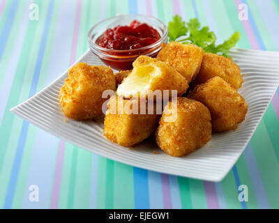 Deep fried camembert cheese in bread crumbs with salad Stock Photo