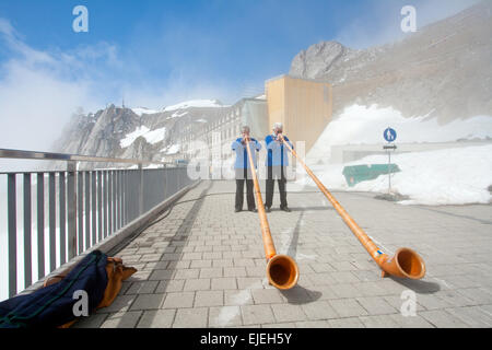 LUCERN, SWITZERLAND - APRIL 10 : Unidentified musicians are playing music with Alpine horns at Pilatus Mountain in Lucern Switze Stock Photo