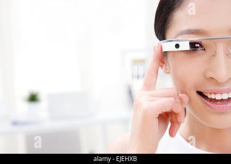 The young business women wearing Google glasses Stock Photo