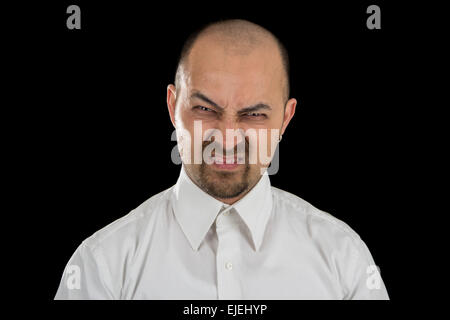 mean looking man isolated on black background Stock Photo