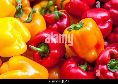 Red and Yellow Peppers on a market stall Stock Photo - Alamy