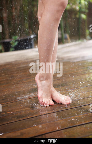 The young woman in the outdoor bathing Stock Photo