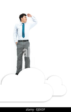 A young business man looked on the cloud Stock Photo