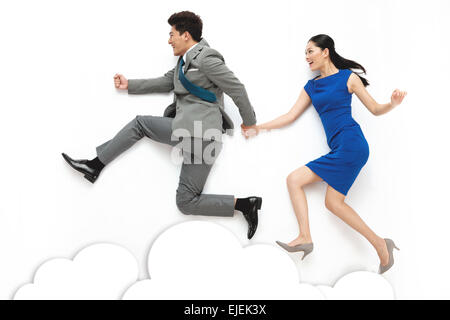 Business men and women holding hands run Stock Photo