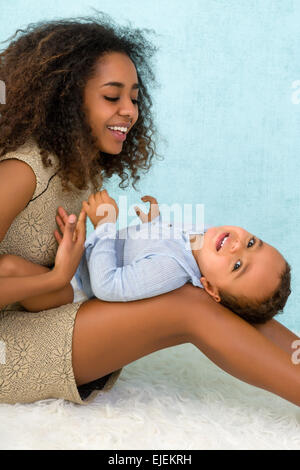 Happy African Ethiopian mother playing with her 18 month old little boy Stock Photo