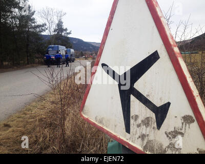 Seyne Les Alpes, France. 25th March, 2015. French gendarmes guard the road to the crash site of Germanwings A320 plane in the Alps in southern France, March 25, 2015. French gendarmes late Tuesday found one of the two black boxes of the German passenger plane that crashed in southern France with 150 people on board, while a joint international probe into the cause of the accident is under way. (Xinhua/ Chen Xiaowei)(azp) Credit:  Xinhua/Alamy Live News Stock Photo