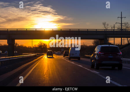 Cars With Sun On Highway During Rush Hour Commute, Philadelphia, USA Stock Photo