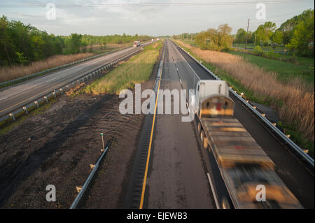 Early morning traffic on the 401 Highway near Iroquois, Ontario, Canada. Stock Photo