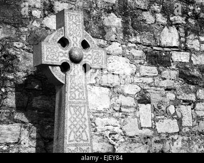 Celtic Cross against a Stone Wall in the Graveyard at the Cathedral St Andrews Fife Scotland Stock Photo