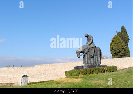 Statue of Saint Francis in bronze in front of the Basilica of San Francesco in Assisi, Umbria, Perugia, Italy. Stock Photo