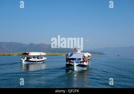 Boats heading out on a day trip to Köyceğiz market, Turkey Stock Photo