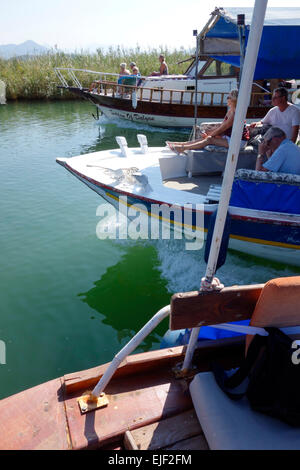 Boats heading out together on a day trip to Köyceğiz market, Turkey Stock Photo