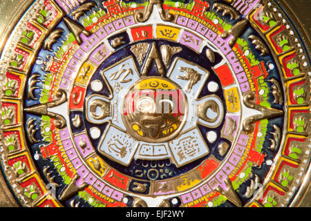 Golden plate full of colors. Aztec Calendar with Tonatiuh from the central disk Stock Photo