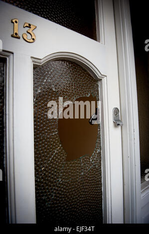 Smashed glass in a door after a burglary Stock Photo